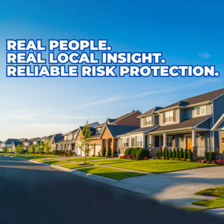 Suburban street with neatly lined houses under a clear blue sky.